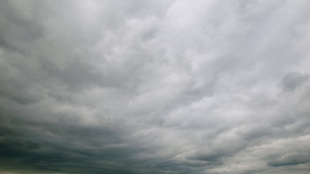 A Dramatic Sky Displaying Gray Clouds Was Beautifully Captured Overhead Above Us