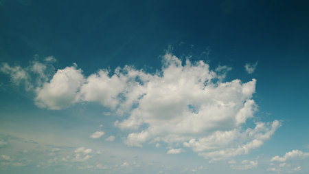 Time lapse. A Clear Blue Sky Dominated by Fluffy White Clouds, Creating a Stunning Atmosphere