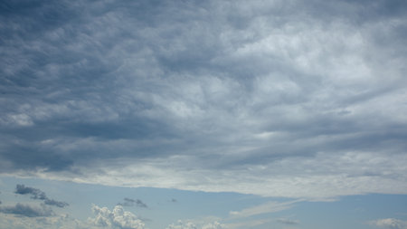 The strikingly dramatic cloudscape overhead creates a mesmerizing view that captivates the eye