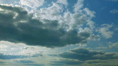 Dramatic and Exquisite Cloud Formation in a Bright and Vibrant Sky Above the Landscape
