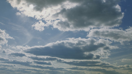 Explore the Dynamic Cloudscapes Set in a Beautifully Vibrant Sky Over the Earth Today