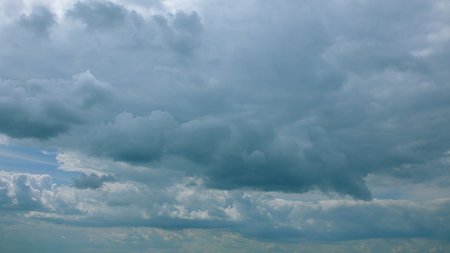 A Dramatic Cloudy Sky Filled with Beautiful Gray Clouds Painting an Atmospheric Sceneの写真素材