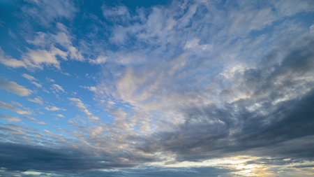 A Serene and Beautiful Sky with Textured Clouds at Dusk, Illuminating the Evening Horizon