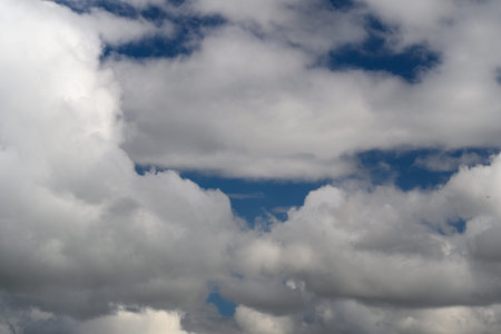 A Stunning and Dramatic Cloudscape Showcasing Beautiful Blue Sky Patches Throughout the Scene