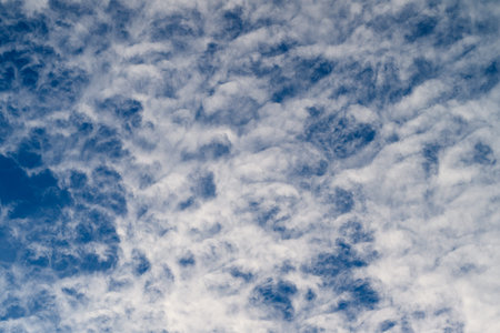 Captivating Dynamic Cloud Patterns Forming Beautifully Against a Bright Blue Sky