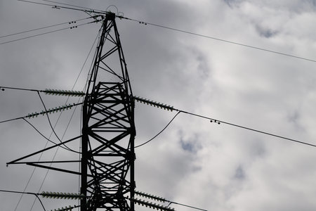 An Industrial Power Tower Reaches for a Cloudy Sky, Symbolizing Modern Energy Solutions