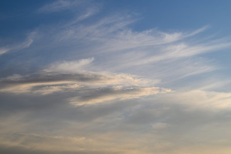 A Beautiful Serene Sky Decorated with Wispy Clouds as Evening Approaches at Dusk