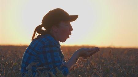 Silhouette of a Person Engaging with the Beauty of Nature at Sunset During Golden Hour