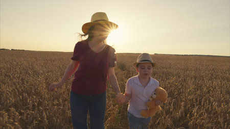 Captivating Joyful Moments in a Lush Wheat Field Shared with a Happy Child on a Sunny Day