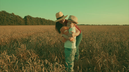 Capture Joyful Moments in a Beautiful Sunlit Field Cherished Mother and Child Bondingの写真素材