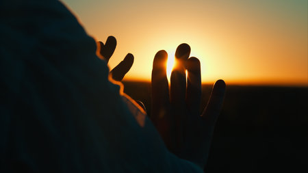 Hands Reaching Out for the Radiant and LifeAffirming Sunrise in Deep Serenity and Calmnessの写真素材