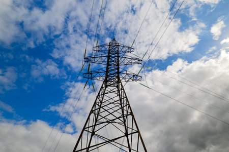 An Electricity Tower Stands Out Against a Dramatic Sky Filled with Blue Clouds and more
