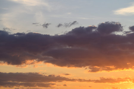 Soft pastel cloudscape at sunset, muted peach and lavender tones, wispy high clouds, tranquil...
