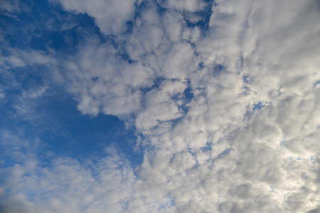 A stunningly beautiful cloud formation contrasts perfectly against a clear blue sky