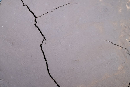 Drought effect on land, Visual depiction of land stress caused by climate change, Closeup of cracked...