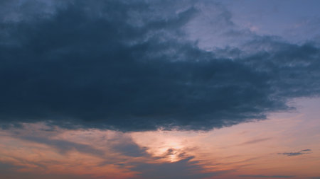 A Beautiful and Dramatic Sunset Creating a Unique Atmosphere Over a Cloudy Sky of Beauty
