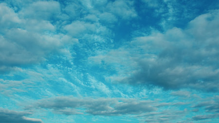 Dynamic Cloudy Sky with a Vividly Bright Blue Background that Engages the Eye and Mind