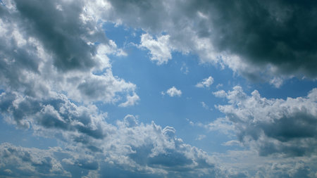 A Dramatic and Stunning Cloudscape Under a Bright, Clear Blue Sky Above Us Throughout the Day