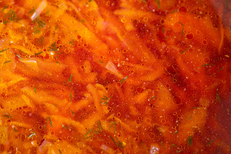 Warm hearty rustic beet and herb soup. Satisfying bowl of colorful vegetable and beet soup....