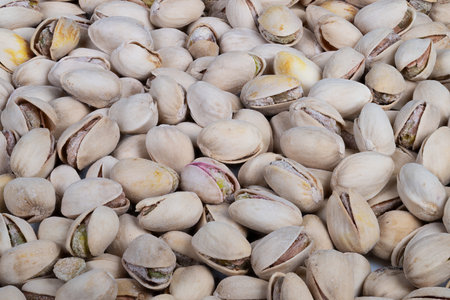 Minimalist pistachios background with even shell coverage, neutral palette and consistent pattern...
