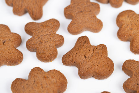 Arrangement of shamrock cookies on white background. Colorful cluster of clovershaped biscuits...
