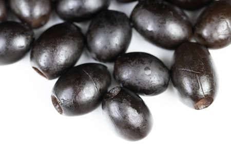 Studio black olives arranged for packaging mockup, artisan market mood with minimal white backdrop, suitable for label design, healthy product and diet campaignsの写真素材