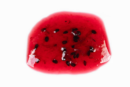 Currant jam showcase. Vivid jam smear with seeds. Bright currant preserve on white background....