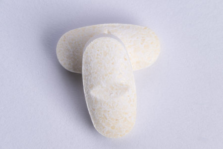 Pills with powdery coat. Closeup of supplement tablets showing coating and compactness. Macro view...