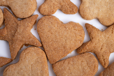 Cozy cookies evoke intimate ambiance, Hearts of gingerbread with rugged edges foster romance, Rustic...