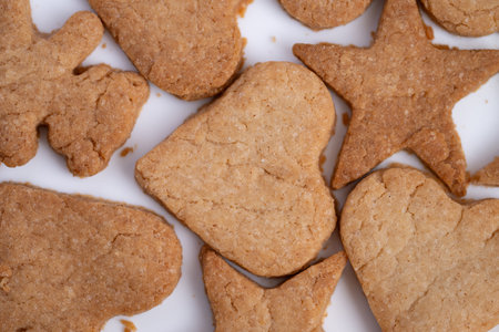 Decorative cookies displayed with vibrant textures and minimal background, Assorted heart and star...