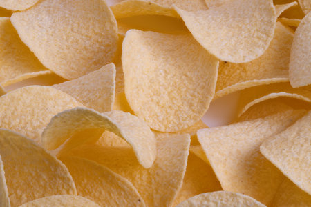 Elegant snack surface, Continuous golden curves in neutral salttoned snack pattern, Repeating potato...