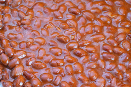 Quick tasty beans, Speedy tasty beans coated with spicy flavoring for snacking, Instant savory bean portions prepared swiftly with seasoned sauce for immediate enjoymentの写真素材