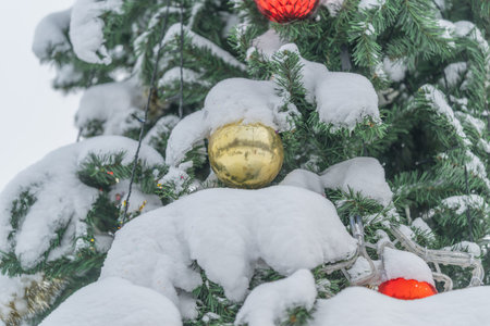 Peaceful snowy scene featuring bright Christmas tree and sparkling decorations, Tranquil winter...