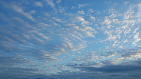 Serene Sky Patterns at Dusk a peaceful, colorful display of clouds transforming the atmosphere