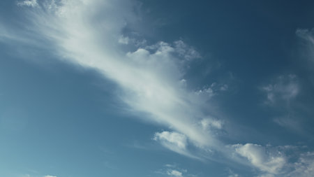 A Serene Sky adorned with Wispy Clouds on a bright, beautiful day in October