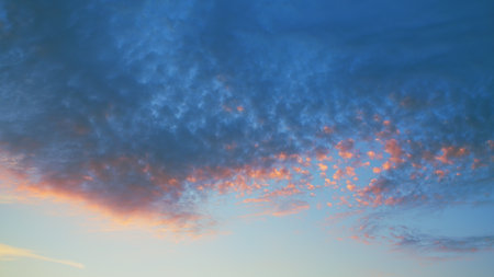 The beautiful, breathtaking sunset clouds paint the vibrant blue sky in stunning colors