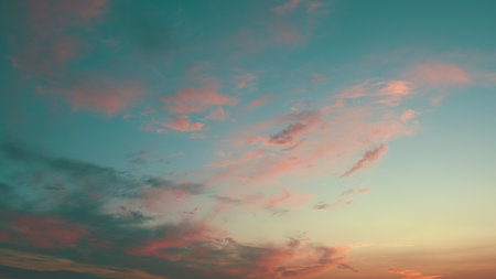 A Beautifully Serene Sunset Sky, Filled with Colorful Clouds and Gradients of Colorful Tonesの写真素材