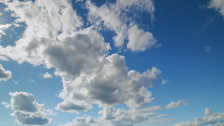 A Beautiful and Peaceful Cloudy Sky Presenting a Lovely and Charming Blue Background High Above Us