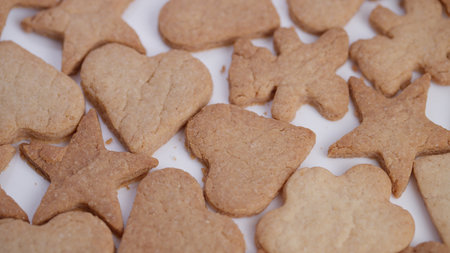 Gingerbread cookies with festive shapes, Closeup display of homemade gingerbread cookies in various...