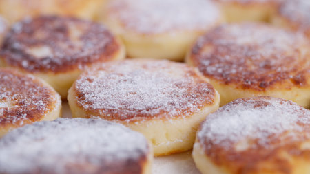 Fluffy cottage cheese pancakes with caramel edges displayed, An appealing photograph featuring soft...