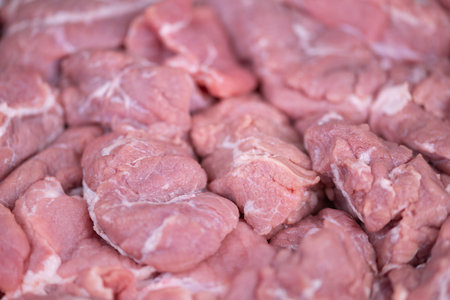Displayed raw meat parcels emphasizing volume and supply nature. Raw protein meat blocks...
