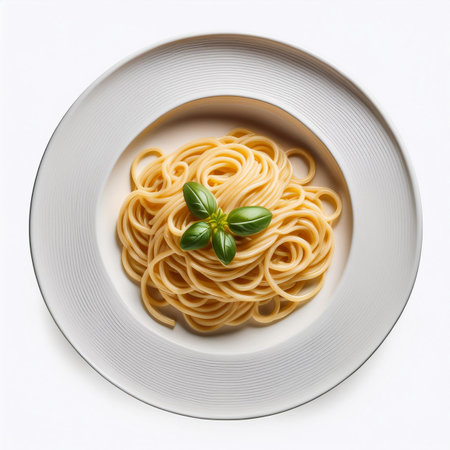 Spaghetti with basil on a white plate isolated on white background.の素材