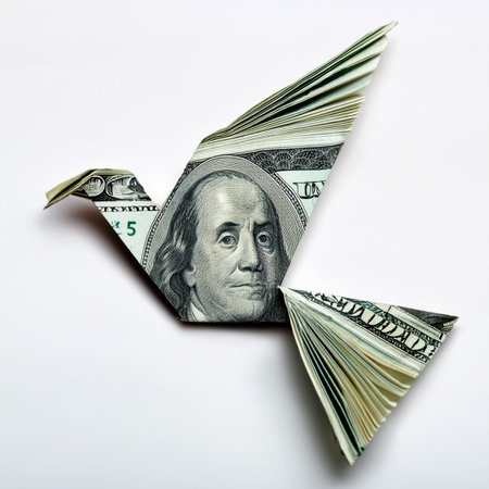 Dollar origami bird isolated on white background. Business concept.の素材
