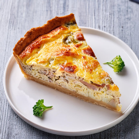 Slice of homemade quiche pie with chicken, mushrooms and cheeseの素材