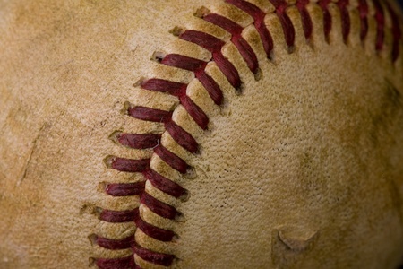 Old worn baseball in macro の写真素材