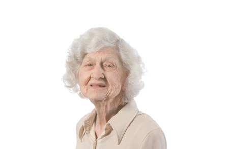 Portrait of happy elder lady  shot against white background の写真素材