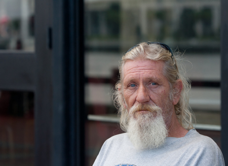 Homeless man with beard outdoors  Image has copyspace available の写真素材