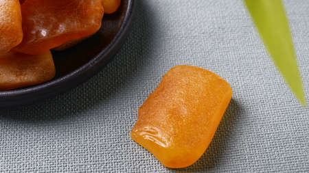 Amber gemstone on a tableの写真素材