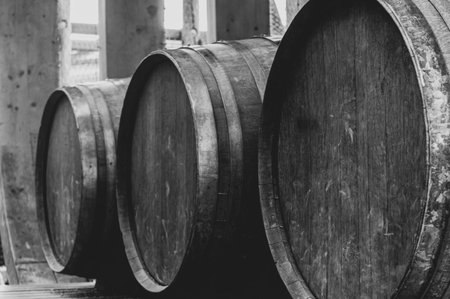 Abstract black and white view of three wooden barrels in rowの写真素材