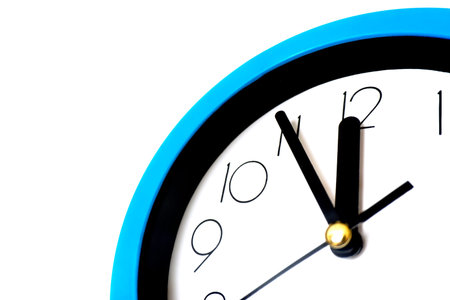 Blue wall clock isolated on white background.